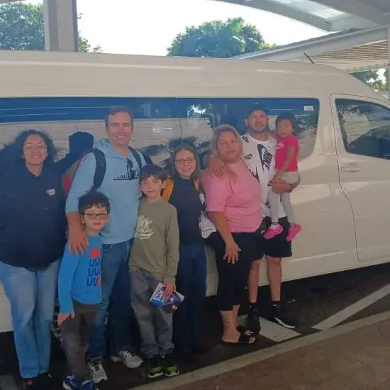 Guests with a Nassau Bahamas Taxi and Tours vehicle